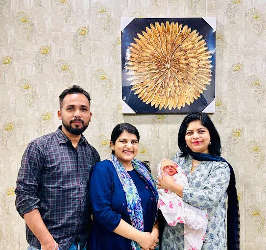 Dr. Bhavya Rathore with a couple and their newborn